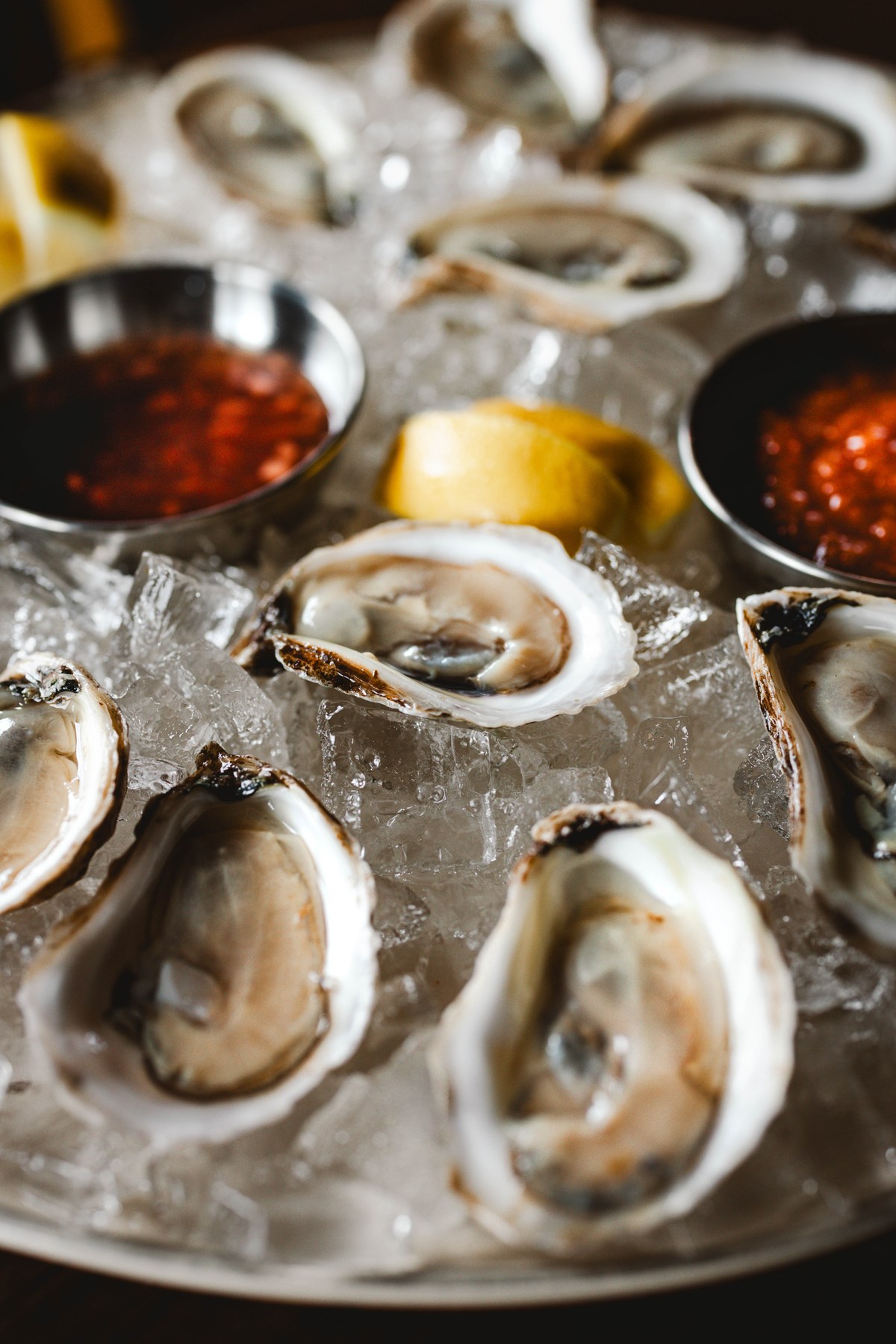 Freshly shucked oysters on crushed ice with mignonette and cocktail sauce